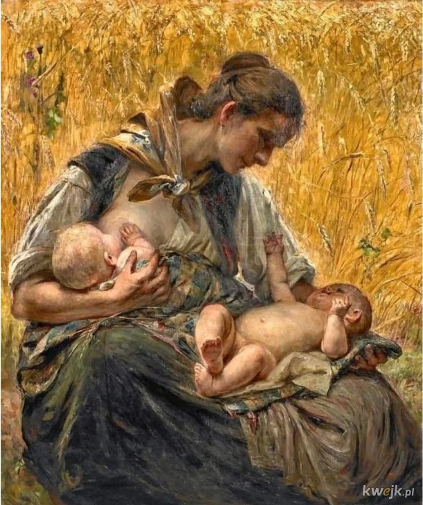 Kobieta karmiąca bliźniaki w polu